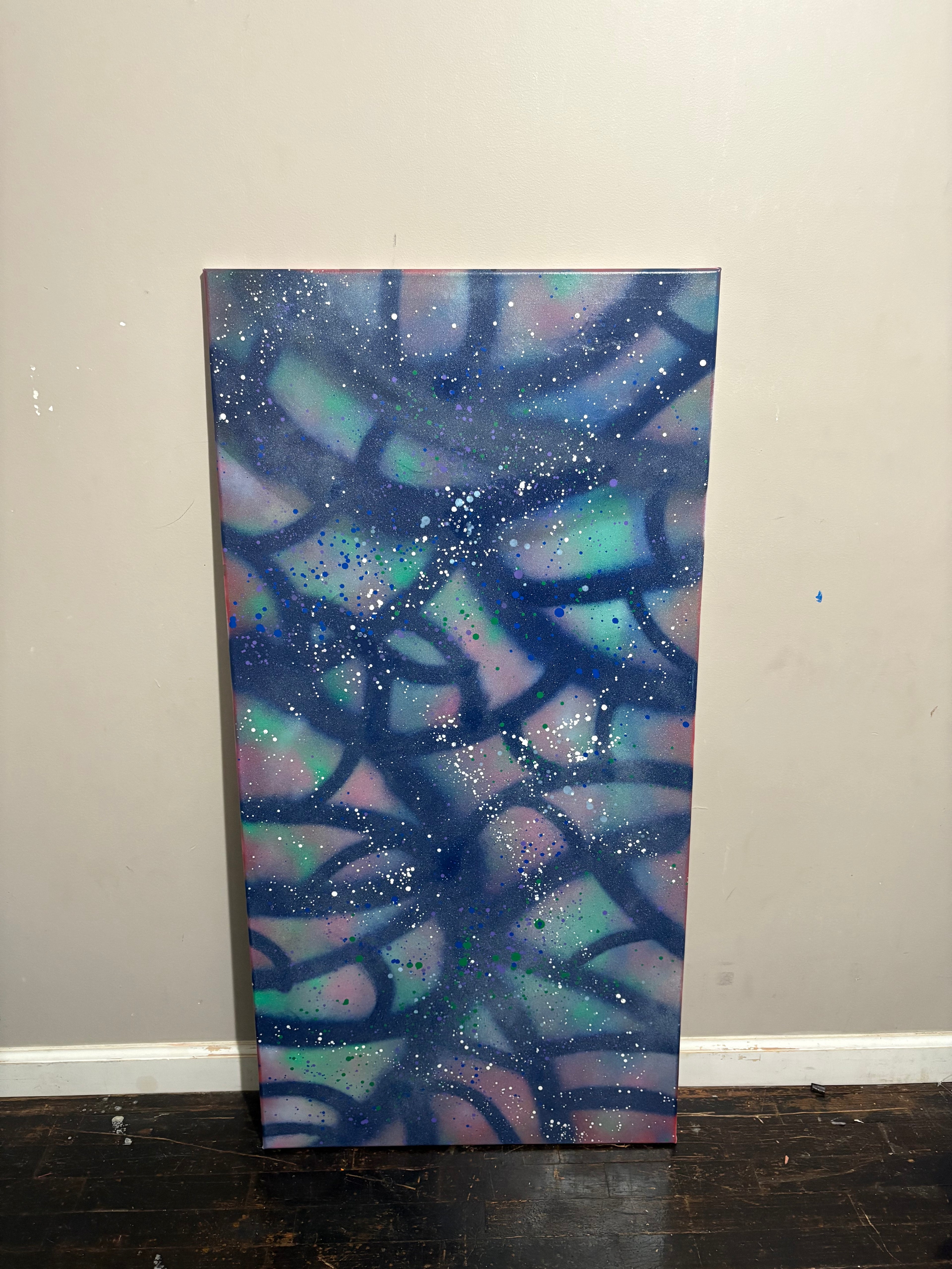 Rainbow fish spray painted canvas